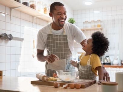 Man cooking with his daughter