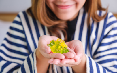 food woman with gummies in her hand