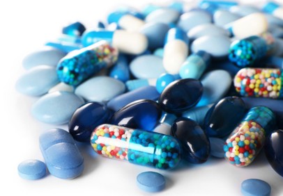 A bunch of pharmaceutical blue capsules.