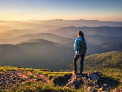 woman in front of a mountain