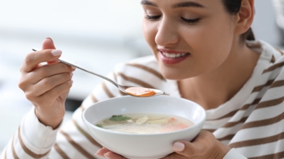 woman eating soup