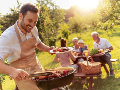 A family is having a picnic with a barbecue