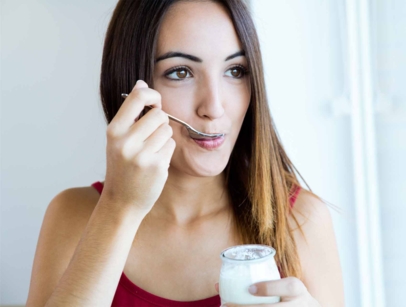 woman eating a yogurt