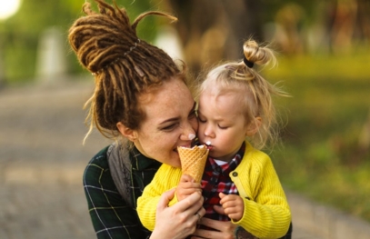 woman and little girl eating ice cream