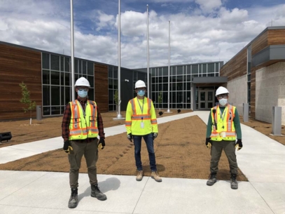 employee in front of building