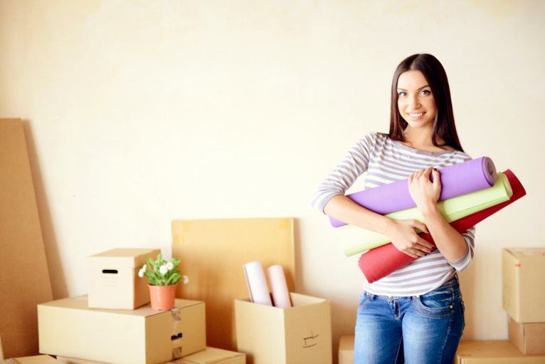 Specialty Papers woman holding wallpapers