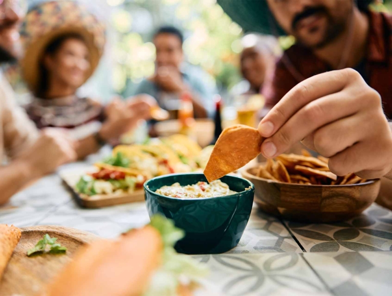 men holding a nachos
